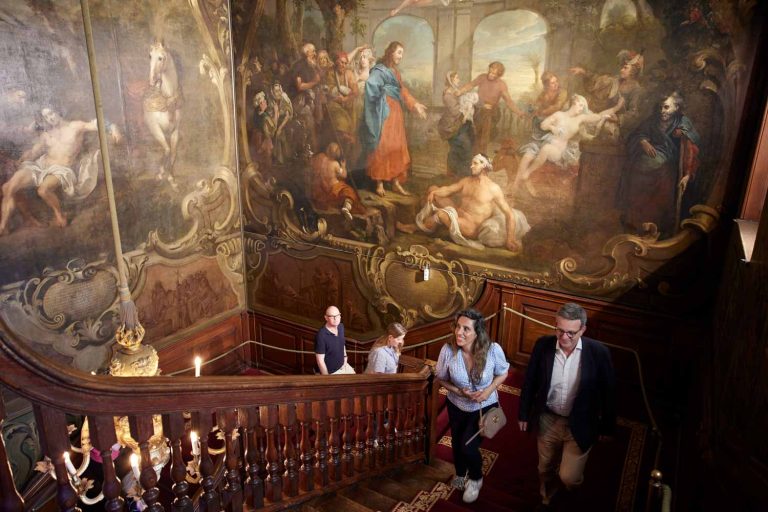 Visitors climb the Hogarth Stair as part of a Tuesday morning tour of Barts North Wing