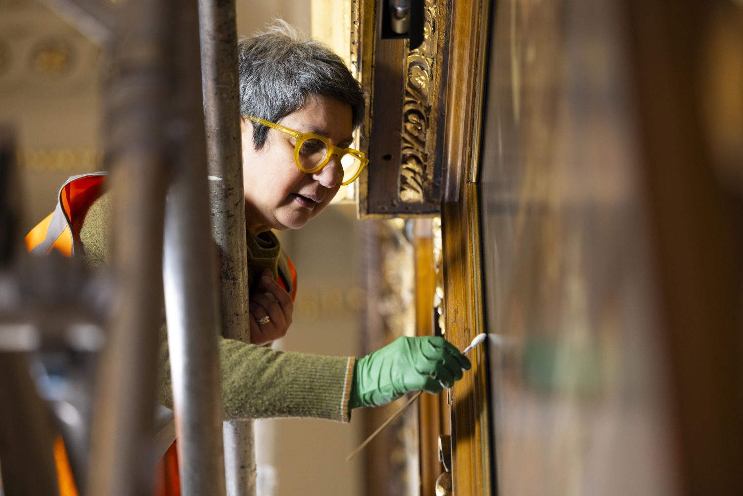 David Parry’s photograph of a conservator at work on one of the Great Hall portraits