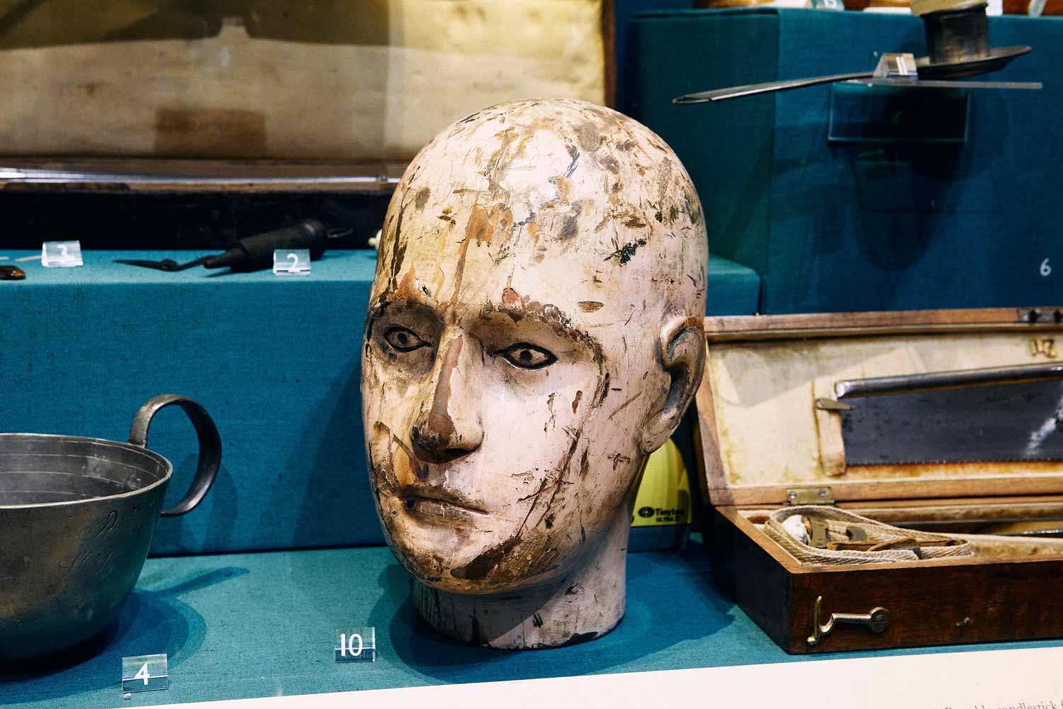 A wooden head is presented in displays in St Bartholomew’s Hospital Museum