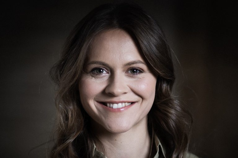 Face of a woman, they are smiling