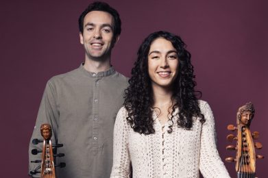 Man and woman each holding a gamba.