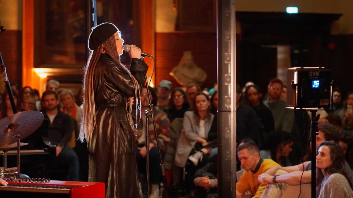 Singer with long dreads and a long leather coat